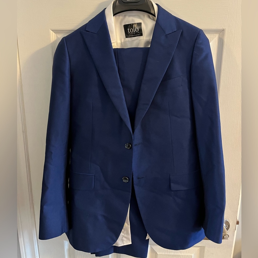 made to wear blue suit jacket, dress pants, and dress shirt *measurements incl.